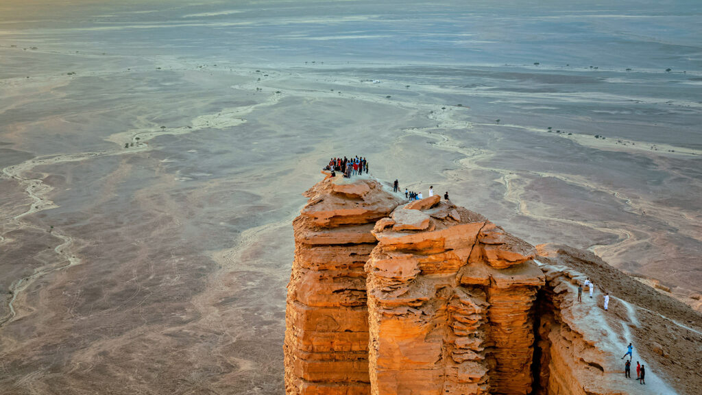 Best outdoor activities in Riyadh Edge of the World hiking trail near Riyadh with panoramic desert views
