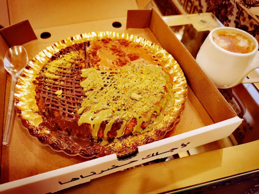 Fresh hot kunafa served in Riyadh dessert shop
