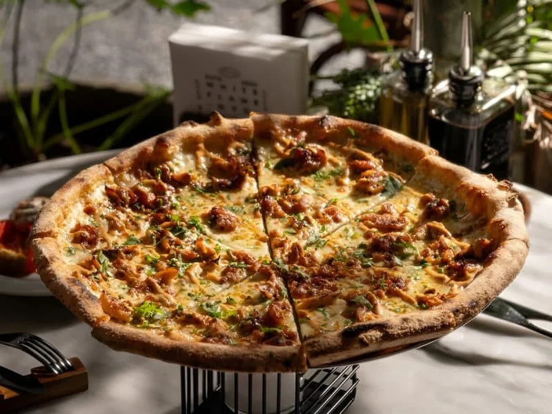 New York style pizza at White Flame Riyadh